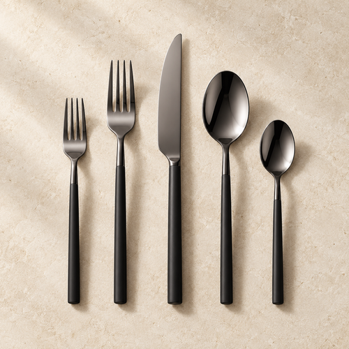Chefcrest black PVD five-piece cutlery set on ivory background